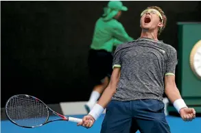  ??  ?? Uzbekistan’s Denis Istomin lets out a roar after beating Serbia’s Novak Djokovic in the second round yesterday.