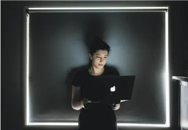  ?? Jason Henry / New York Times ?? Renee DiResta works on a computer at her San Francisco home. She has warned about social media bots.