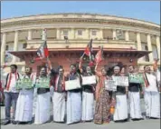  ?? PTI ?? AIADMK MPs raise slogans demanding the constituti­on for the Cauvery Management outside the Parliament House in New Delhi on Monday.