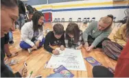  ?? JOSH CLARK/USA TODAY NETWORK-WISCONSIN ?? Appleton students work on a suicide prevention project with the Sources of Strength program.