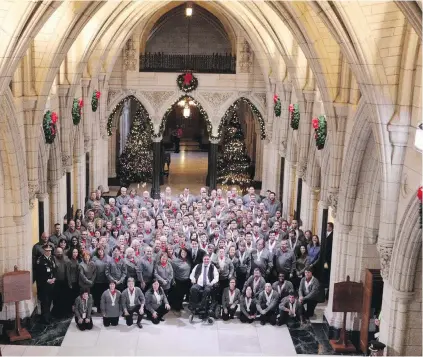  ??  ?? Canada’s Special Olympians pose for a team photo Wednesday during a visit to Parliament. They were joined by Prime Minister Justin Trudeau, front centre, and Kent Hehr, minister of Sport and Persons with Disabiliti­es, in wheelchair.