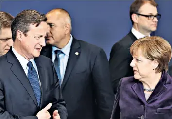  ?? IMAGES AFP/GETTY ?? Summit strife : the Prime Minister and Angela Merkel in Brussels 10 days ago