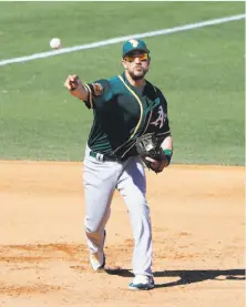  ?? Darron Cummings / Associated Press ?? Trevor Plouffe’s somewhat unorthodox throwing technique at third is a product of his time playing the outfield.