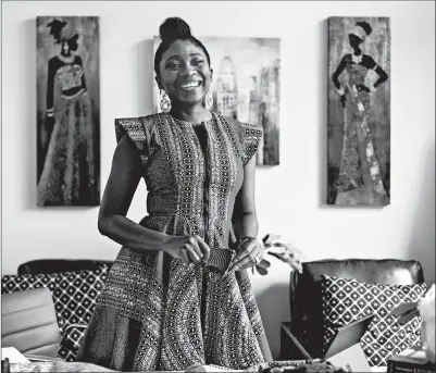  ?? MICHAEL STARGHILL JR./THE NEW YORK TIMES ?? “I would like to see African print everywhere,” said designer Yetunde Olukoya, at her home in Fulshear, Texas.