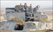  ?? AFP ?? A Syrian soldier flashes the "V for victory” sign during an operation against the Islamic State in Deir elZour.