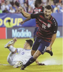  ?? AP PHOTO ?? STRIKING GOLD: Eric Lichaj celebrates after scoring for the United States in last night’s 2-0 victory against El Salvador.