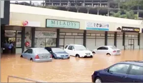  ?? (File pic) ?? Not only shops were affected by the flash flooding at the Mbabane Mall but even private cars were submerged in water.