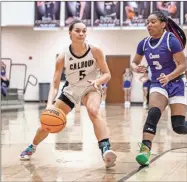  ?? Tim Godbee ?? Calhoun sophomore forward Kat Atha puts the ball on the floor against a Cartersvil­le defender. Atha had 16 points in the Lady Jackets win over the Purple Hurricanes.