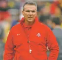  ?? ASSOCIATED PRESS FILE PHOTO ?? Ohio State football coach Urban Meyer is being punished for keeping an assistant on his staff for several years after the coach’s wife accused him of abuse.