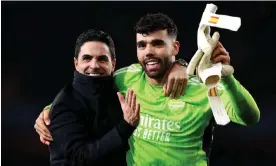  ?? Photograph: Julian Finney/Getty Images ?? Mikel Arteta and David Raya celebrate Arsenal’s shootout victory over Porto in the last 16.