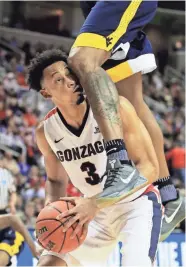  ?? GETTY IMAGES ?? Gonzaga’s Elijah Macon gets nailed in the face.