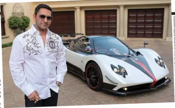  ??  ?? Flash: Cigar-smoking Zunaid Moti poses in front of a Pagani Zonda super car