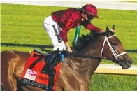  ?? The Associated Press ?? ■ Jockey Florent Geroux pats Shedaresth­edevil on the head after winning the 146th running of the Kentucky Oaks on Sept. 4, 2020, at Churchill Downs in Louisville, Ky. The 4-year-old filly posted her fourth graded victory of 2021 Saturday night in the $400,000 Locust Grove at Churchill Downs.