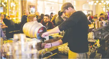  ??  ?? Bartender Fraser Flett serves sour beer at last year’s Pucker Up event at the Garrick’s Head Pub. This year’s event takes place Thursday at 7:30 p.m. at the Victoria Public Market.