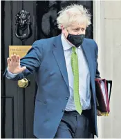  ?? ?? Boris Johnson leaves Downing Street for Prime Minister’s Questions on Wednesday, where he was supported by his closest allies