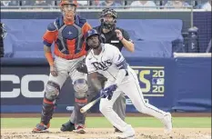  ?? Ezra Shaw / Getty Images ?? Randy Arozarena of the Rays follows his two-run home run in the first inning against Houston on Saturday night.