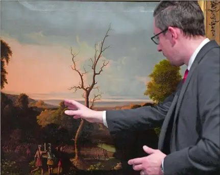  ?? ?? Director Dayne Rugh talks about some of the details in “The Capture of Miantonomo,” an oil painting done by John Denison Crocker in 1847 that is on display at the Slater Memorial Museum at Norwich Free Academy.
