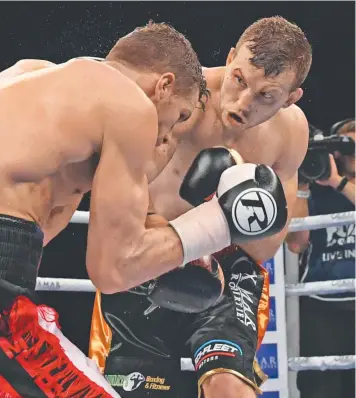  ??  ?? Queensland’s Jeff Horn (right) beat UK boxer Gary Corcoran by TKO on Wednesday. Picture: AAP