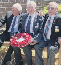  ?? ?? Three veterans on the bench honouring HMS Coventry sailors.