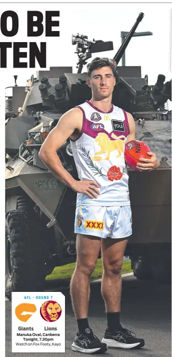  ?? Picture: Lyndon Mechielsen/courier Mail ?? Brisbane Lions defender Noah Answerth with an Army ASLAV at the Brighton Homes Arena in Springfiel­d.