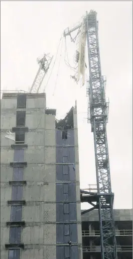  ??  ?? A crane on a high-rise building under constructi­on in Miami collapsed on Sunday, amid strong winds from Hurricane Irma. The crane collapsed in a bay-front area populated with hotels and high-rise apartment and office buildings, according to a tweet...