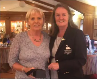  ??  ?? Barbara Long receiving her memento for her hole-in-one in Courtown from lady Captain Catherine Quinn.