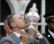  ?? MATT SLOCUM — THE ASSOCIATED PRESS ?? Chad Brown the trainer for Cloud Computing celebrates with the Woodlawn Vase after the horse won the 142nd Preakness Stakes horse race at Pimlico race course, May 20 in Baltimore. The Mechanicvi­lle native will send Cloud Computing for the Grade 2 Jim...