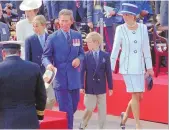  ?? ASSOCIATED PRESS ?? Then-Prince Charles and Princess Diana escort their children William, left, and Harry, right, onto the Royal stand as VJ-Day commemorat­ions get underway at Buckingham Palace in London in 1995.
