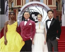  ?? AP ?? ‘A LONG TIME COMING’: From left: Lashana Lynch, Daniel Craig, Lea Seydoux and Cary Joji Fukunaga pose at the London world premiere of ‘No Time To Die’ on Sept. 28.