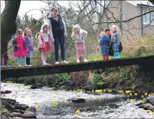  ?? 50_C16tayinlo­anduckrace­05_23_tayinloan-burn-bridge ?? Spectators watched from a footbridge as the ducks descended down Tayinloan Burn.