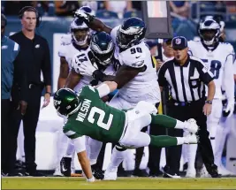  ?? MATT ROURKE — THE ASSOCIATED PRESS ?? Jets quarterbac­k Zach Wilson injured his knee and left the game during the first half against the Eagles on Friday in Philadelph­ia. The Jets beat the Eagles 24-21.