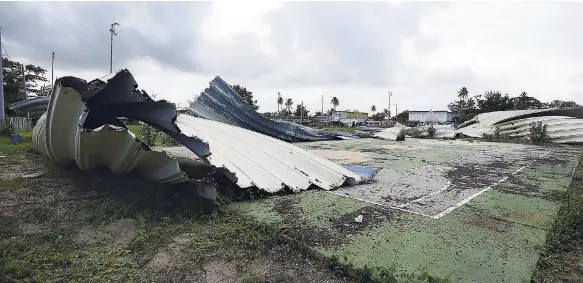  ??  ?? In this October 11, 2018 photo, the basketball court of the Parcelas Suarez community still has no roof a year after the passage of Hurricane Maria, in Loiza, Puerto Rico.