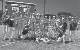  ?? AKEEM GLASPIE/INDYSTAR ?? Mooresvill­e players and coaches pose with the sectional trophy after beating Center Grove in the final on Monday.