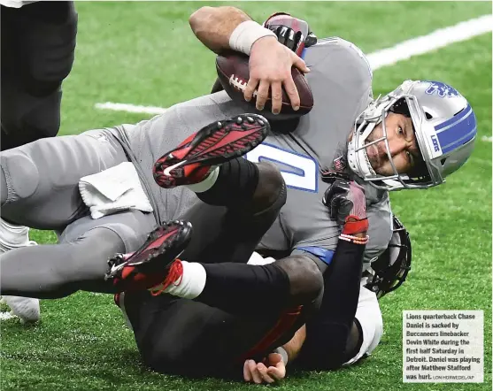  ?? LON HORWEDEL/ AP ?? Lions quarterbac­k Chase Daniel is sacked by Buccaneers linebacker Devin White during the first half Saturday in Detroit. Daniel was playing after Matthew Stafford
was hurt.