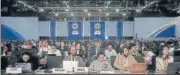  ?? AP ?? Attendees listen to a review of the state of discussion­s at the COP27 summit on Friday.