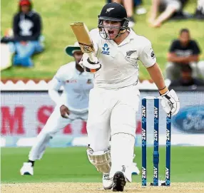  ??  ?? Getting intense: New Zealand’s Tom Latham celebrates after carving out his sixth century during day three of the first Test against Bangladesh at the Basin Reserve in Wellington yesterday. — AFP — AFP.