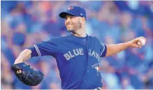  ?? JOHN SLEEZER/KANSAS CITY STAR ?? Toronto Blue Jays pitcher J.A. Happ throws against the Kansas City Royals at Kauffman Stadium in Kansas City, Mo. Now with the New York Yankees, Happ is battling hand, foot and mouth disease.