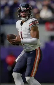  ?? (AP/Stacy Bengs) ?? Chicago Bears quarterbac­k Justin Fields set career highs in completion percentage (71.4%) and passer rating (118.8) in last week’s 29-22 loss to the Minnesota Vikings.