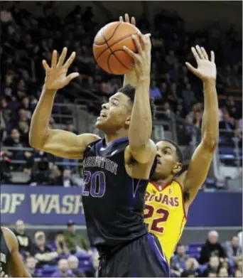  ?? ELAINE THOMPSON — THE ASSOCIATED PRESS FILE ?? Washington’s Markelle Fultz (20) drives to the basket ahead of Southern California’s De’Anthony Melton during the first half of a game in Seattle. Fultz is expected to be the top pick in the NBA Draft on Thursday.