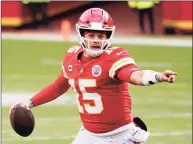  ?? Charlie Riedel / Associated Press ?? Kansas City Chiefs quarterbac­k Patrick Mahomes looks for a receiver during the second half of a NFL divisional round game against the Cleveland Browns on Sunday in Kansas City, Mo.