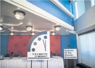  ?? EPA ?? The so-called ‘Doomsday Clock’ is on display after a press conference at the National Press Club in Washington on Thursday. The Bulletin of the Atomic Scientists developed the Doomsday Clock as a symbol to ‘represent the likelihood of a man-made global...