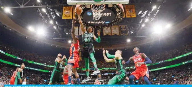  ?? — AFP ?? BOSTON: Robert Williams #44 of the Boston Celtics blocks the ball against the New Orleans Pelicans on Monday at the TD Garden in Boston, Massachuse­tts.