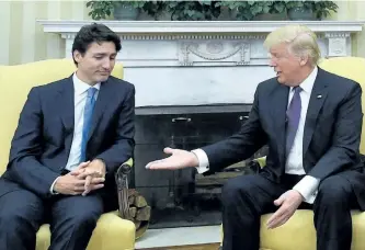  ?? SEAN KILPATRICK/THE CANADIAN PRESS ?? Prime Minister Justin Trudeau meets with U.S. President Donald Trump in Washington, D.C., on Monday. Despite this moment before the two shook hands, a joint statement on shared priorities seemed to suggest the first-in-person encounters between the...