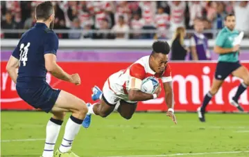 ??  ?? HIGH- FLYING STAR . . . Japanese star Kotaro Munyaradzi Matsushima, who has a Zimbabwean father and Japanese mother, roars in to score his country’s first try,and his fifth at this World Cup, against Scotland in Yokohama yesterday — AFP