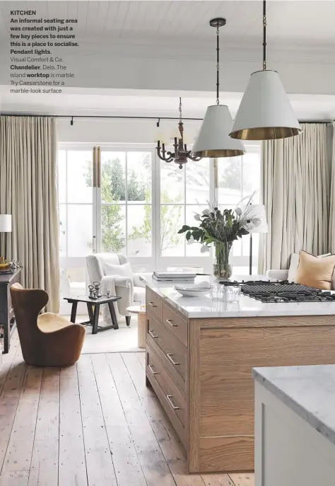  ??  ?? KITCHEN
An informal seating area was created with just a few key pieces to ensure this is a place to socialise. Pendant lights,
Visual Comfort & Co.
Chandelier, Delo. The island worktop is marble. Try Caesarston­e for a marble-look surface