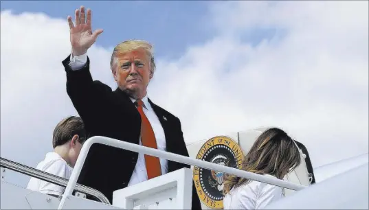  ?? Manuel Balce Ceneta The Associated Press ?? President Donald Trump, first lady Melania Trump and son Barron Trump board Air Force One at Andrews Air Force Base, Md., on Friday for a trip to Bedminster, N.J.