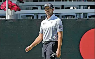  ?? JOHN RAOUX / AP ?? Corey Conners reacts as he watches his putt on the 17th hole during the second round of the Arnold Palmer Invitation­al on Friday in Orlando, Fla.