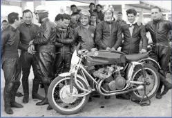  ??  ?? MV Agusta team photo from 1953 with their first World Champion Cecil Sandford second from right, next to team mate Bill Lomas. Beside Lomas is Bruno Francisci and Carlo Ubbiali (arms folded).