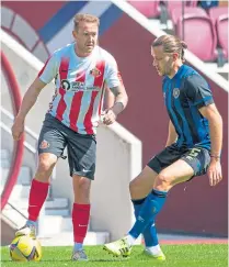  ?? ?? Aiden Mcgeady up against Hearts’ Peter Haring while playing in a friendly at Tynecastle last July