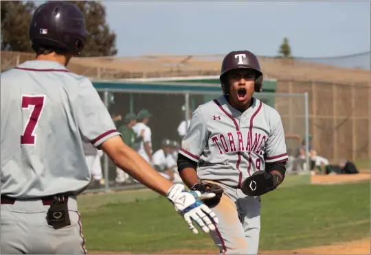  ?? PHOTO BY CHUCK BENNETT ?? Senior Ricky Ahumada, right, and Torrance are ranked No. 1in the area with a record of 9-2. The Tartars began their Pioneer League schedule with a two-game sweep of West.